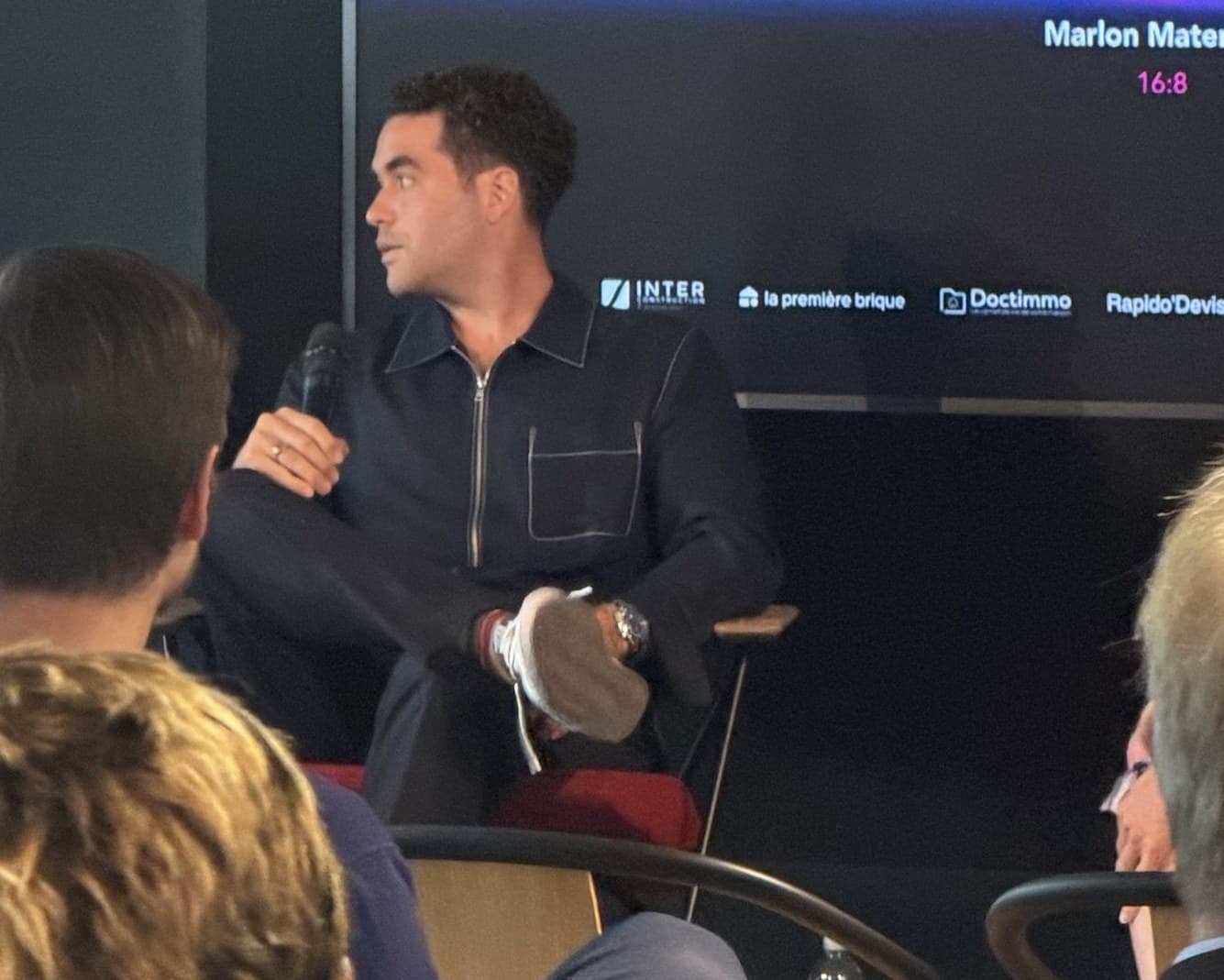 Marlon Maternati speaking on stage at Paris Opportunity Week